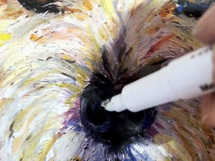 A white paint pen adding highlights to the nose of a finished portrait